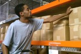 warehouse worker stocking shelves